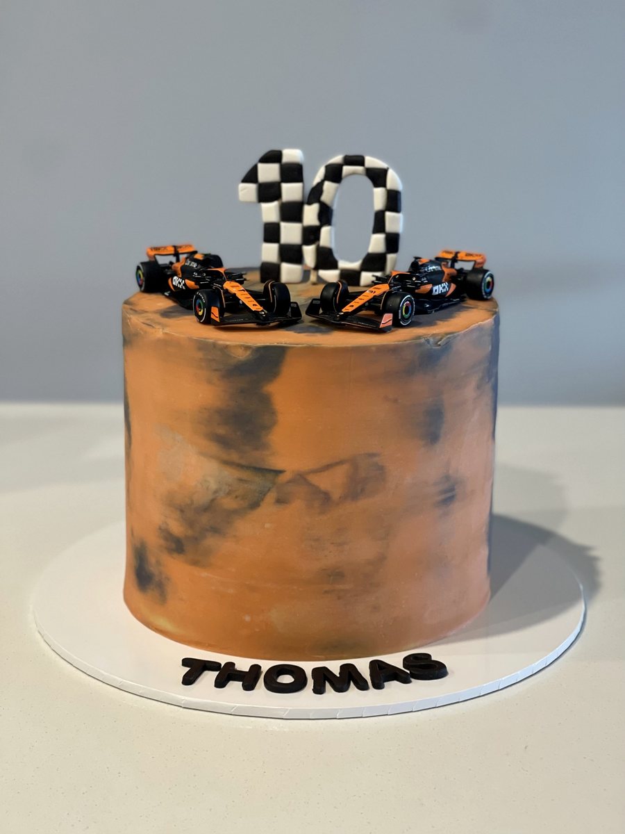 Marbled terracotta cake with a chequered number topper