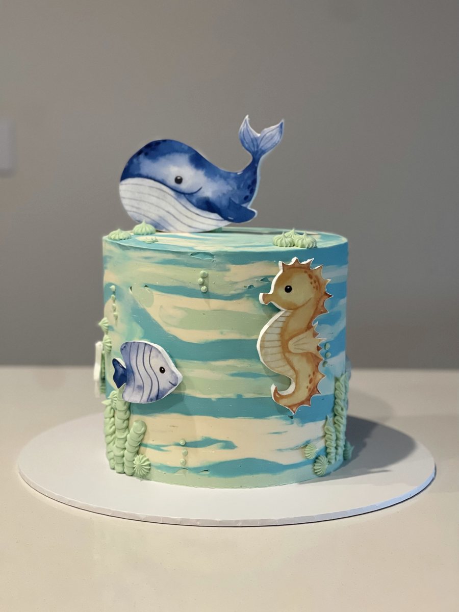 Watercolour sea cake with a hand-painted whale